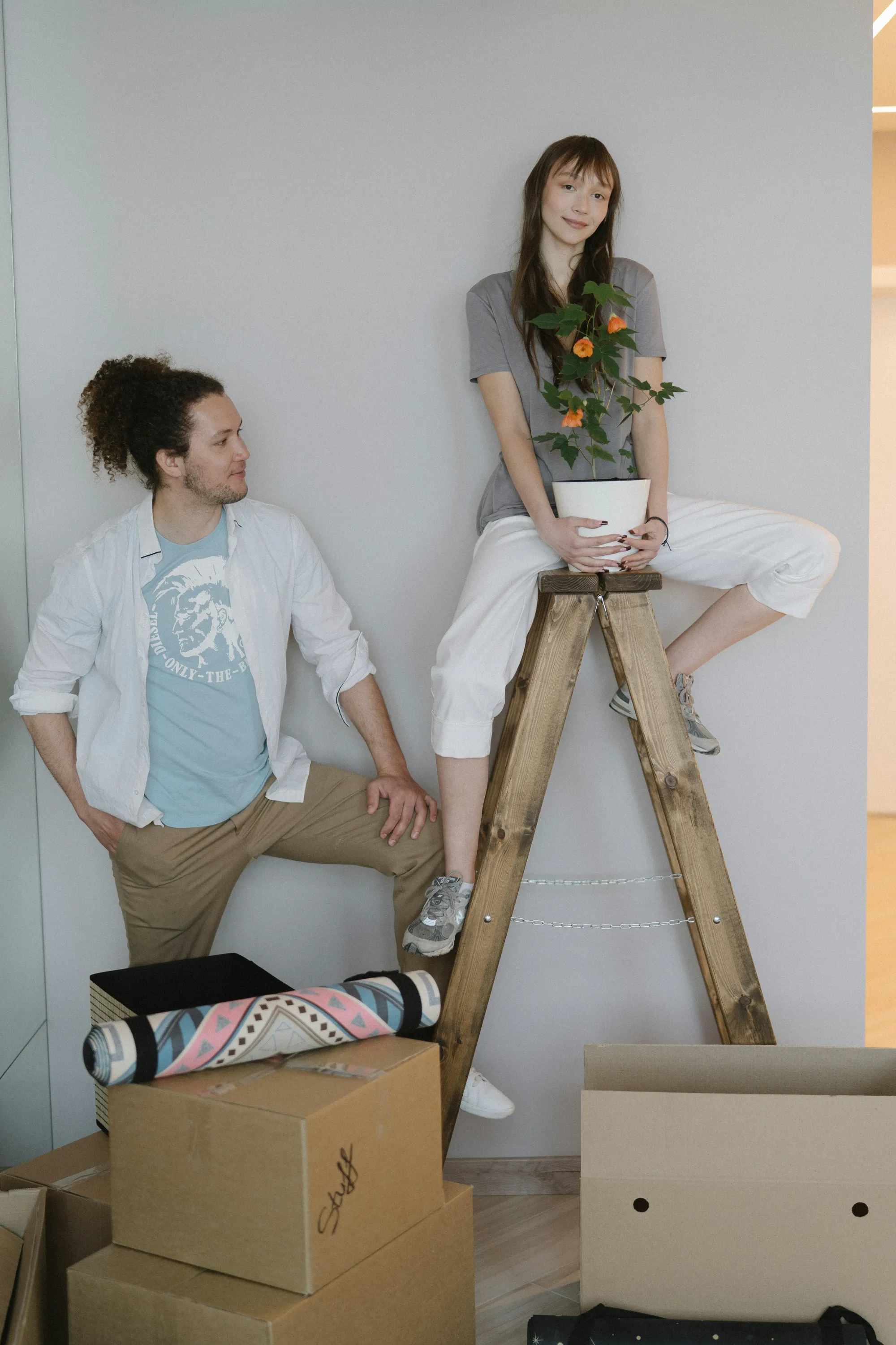 Man and woman by ladder